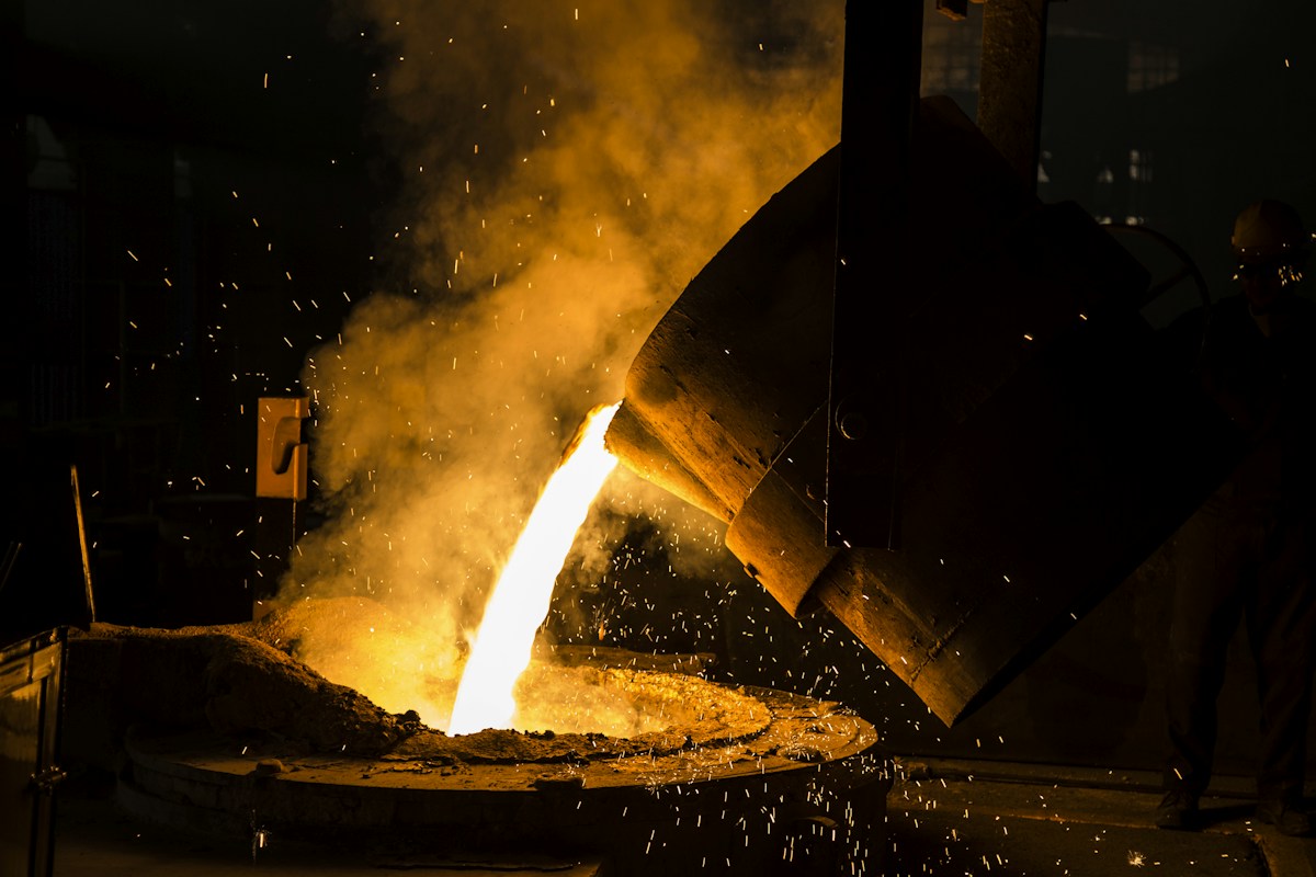 Green steel manufacturing facility with low-emission furnace technology